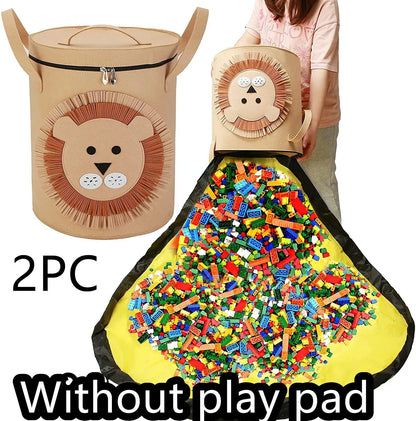 Green felt storage cube with pull rope unfolded into a large square play mat on a wooden floor.