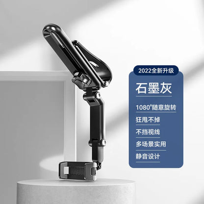 Grey and green car phone bracket with adjustable clip mounted on a car dashboard