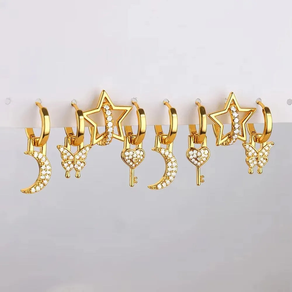 Women's irregular geometric butterfly earrings in copper with diamond treatment, showing heart-shaped and star designs in various colours