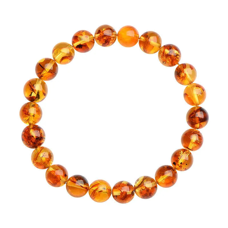 Natural yellow piebald amber bracelet with 7-10mm geometric beads on wrist