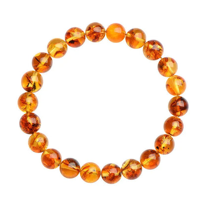 Natural yellow piebald amber bracelet with 7-10mm geometric beads on wrist