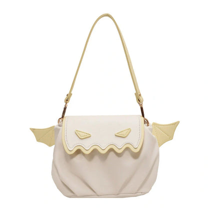 Halloween pumpkin cartoon crossbody bag with small wings in black, white, and orange