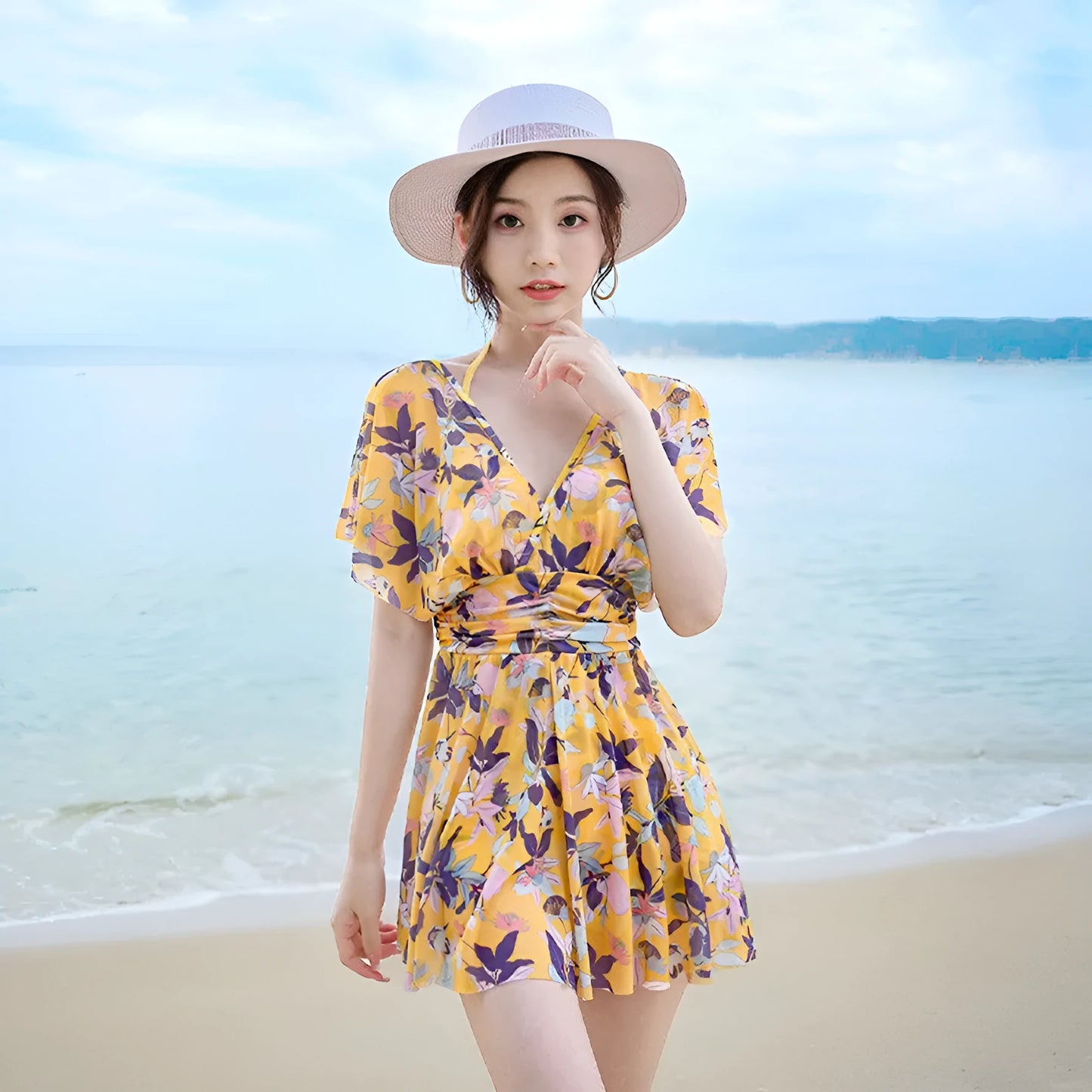 Yellow floral pattern women's one-piece swimsuit on hanger