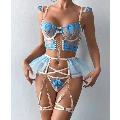 Light blue embroidered lace bra and knicker set with transparent mesh panels on a mannequin.