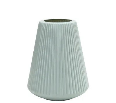 Melamine plastic decorative vase in blue colour measuring 16cm by 20cm on wooden desk