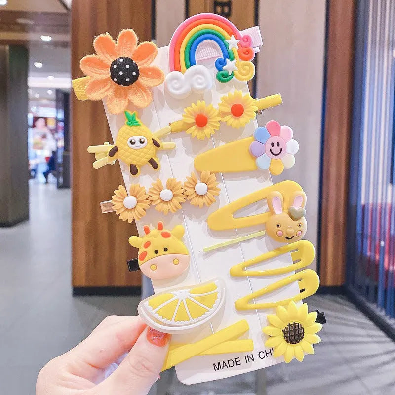 14-piece toddler hair accessories set showing colourful candy rainbow barrettes, fruit clips, and butterfly hair pins