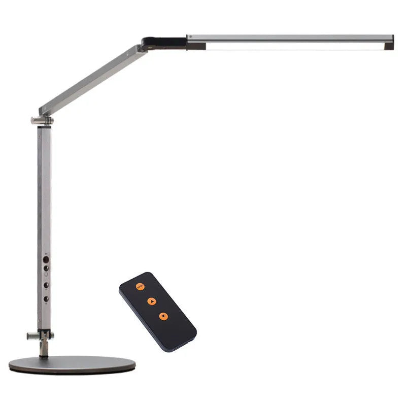 Clip-on adjustable arm LED desk lamp in black mounted on a desk edge with remote control.