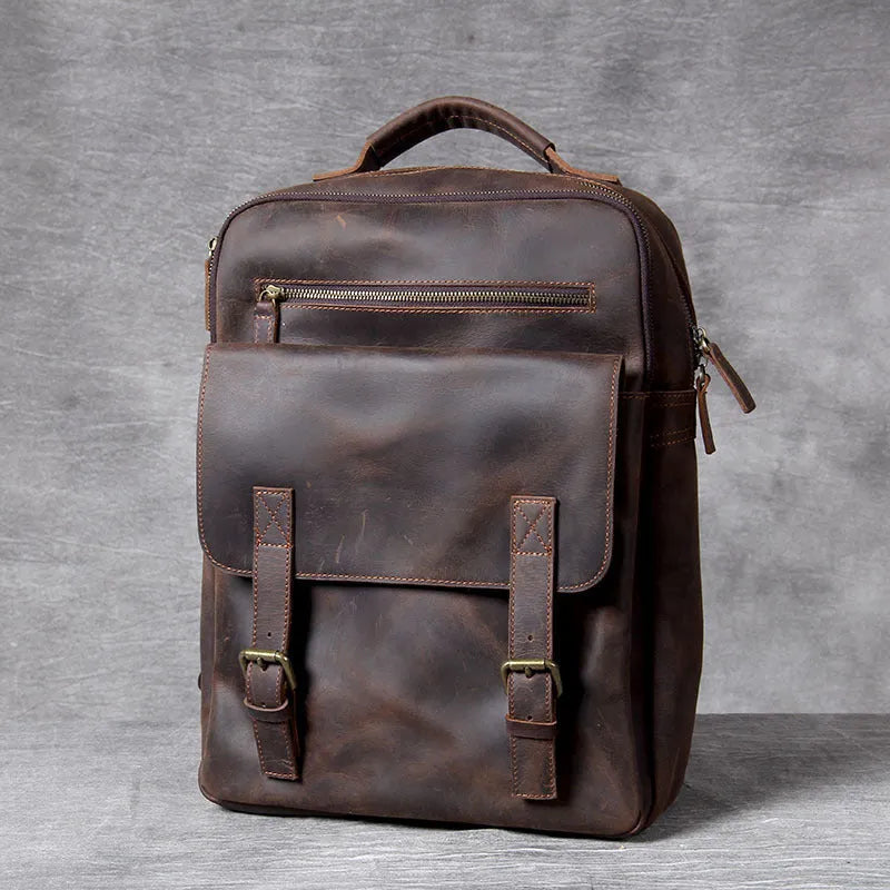 Dark coffee coloured retro leather backpack made from first layer cowhide with organised interior pockets.