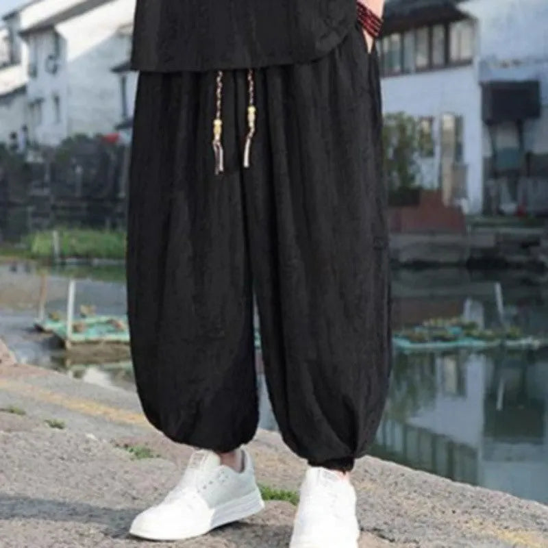 Men's black and grey knitted short-sleeve top with matching loose cropped trousers casual suit set