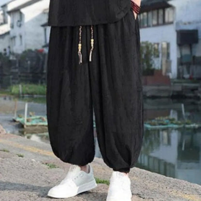 Men's black and grey knitted short-sleeve top with matching loose cropped trousers casual suit set