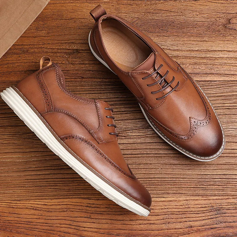 Men's black and brown slip-on business casual shoes with round toe and carved PU upper.