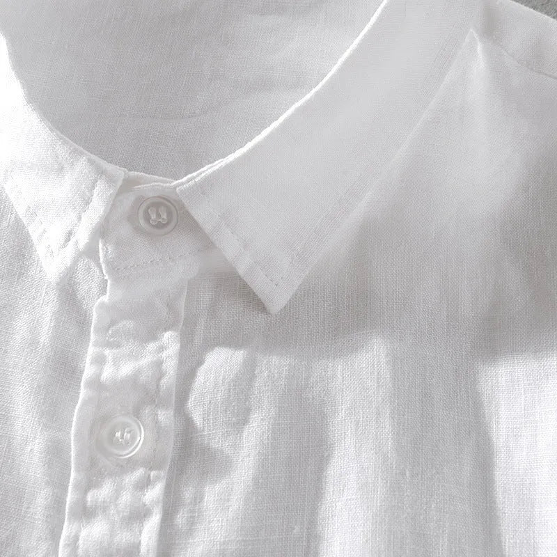 Men's light blue short sleeve linen blend casual shirt with a loose fit.