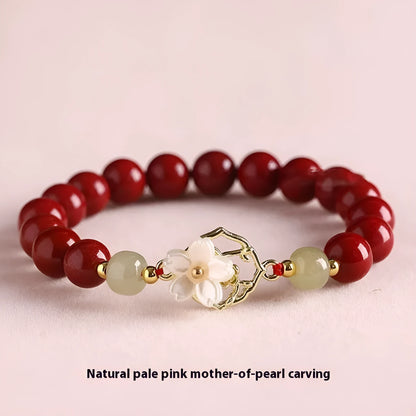 Handcrafted Hetian Jade New Chinese style bracelet in cinnabar with white butterfly, lotus and bells of Ireland motifs