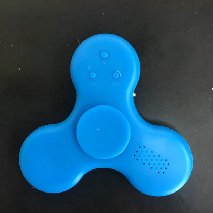 White Bluetooth speaker fidget spinner EDC toy with MP3 player functionality showing compact design