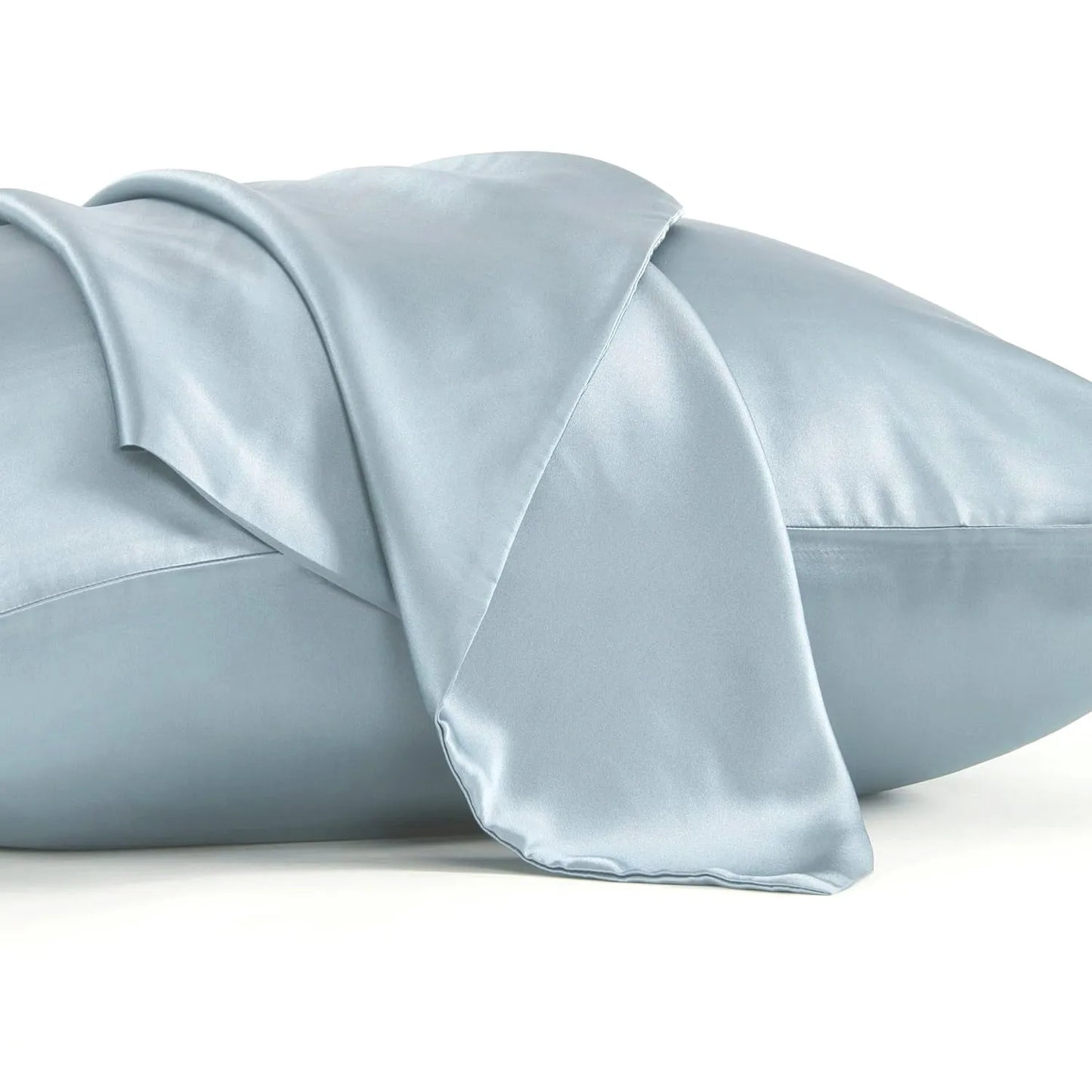 Dark grey silk pillowcase with envelope closure on a bed.