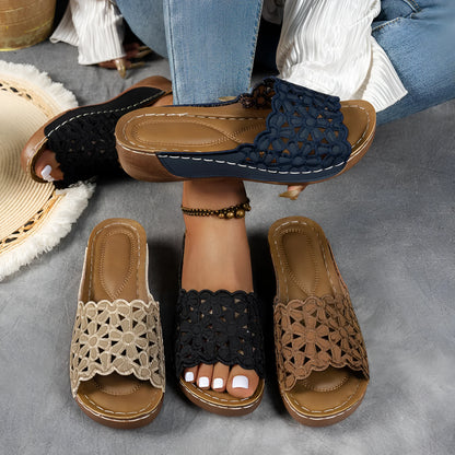 Women's black wedge beach slippers with flower cutout decoration on the PVC upper