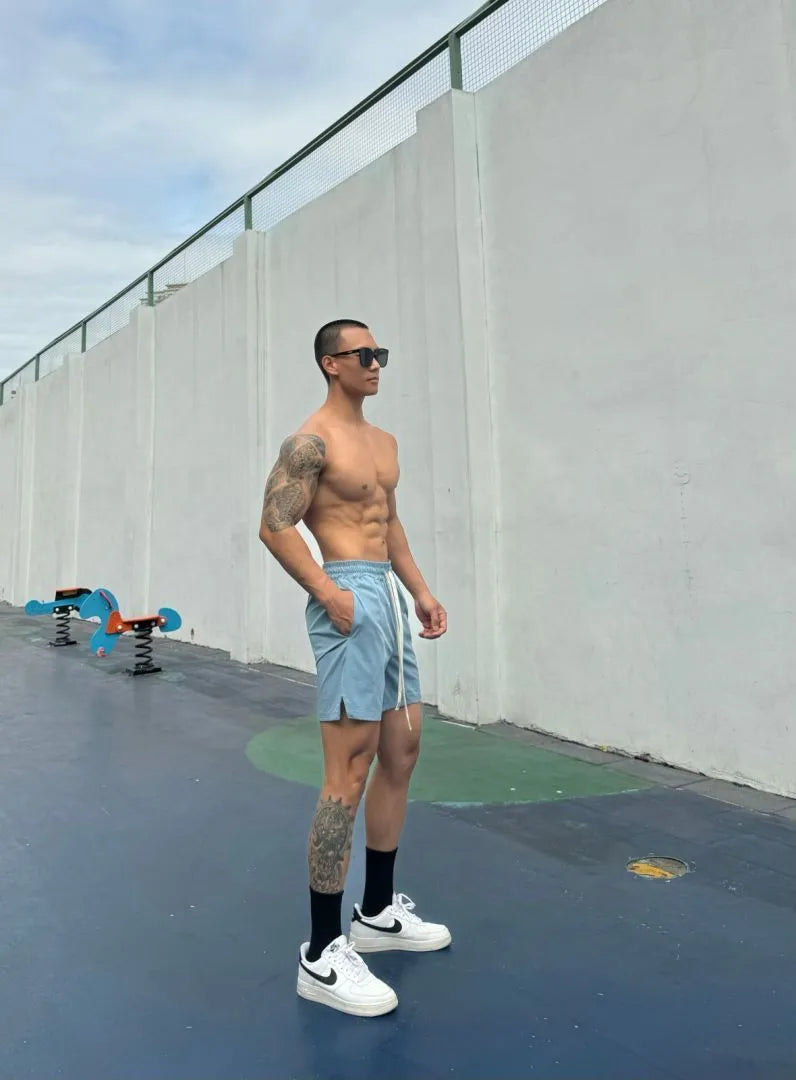 Men's ice silk quick-drying double-layer shorts in quarter-length design with nylon fabric