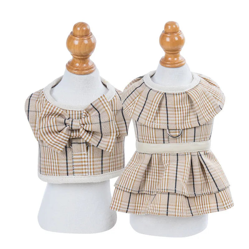 Dog wearing chest strap vest harness with attached leash in milky white or purple colour