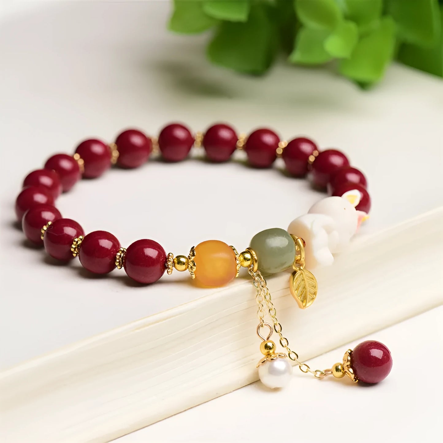 Natural cinnabar rabbit bracelet in beeswax purple and gold sand, national style, shown in 8mm and 10mm sizes.