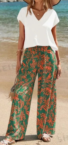 Women's solid V-neck short sleeve top and botanical print pants set in woven fabric