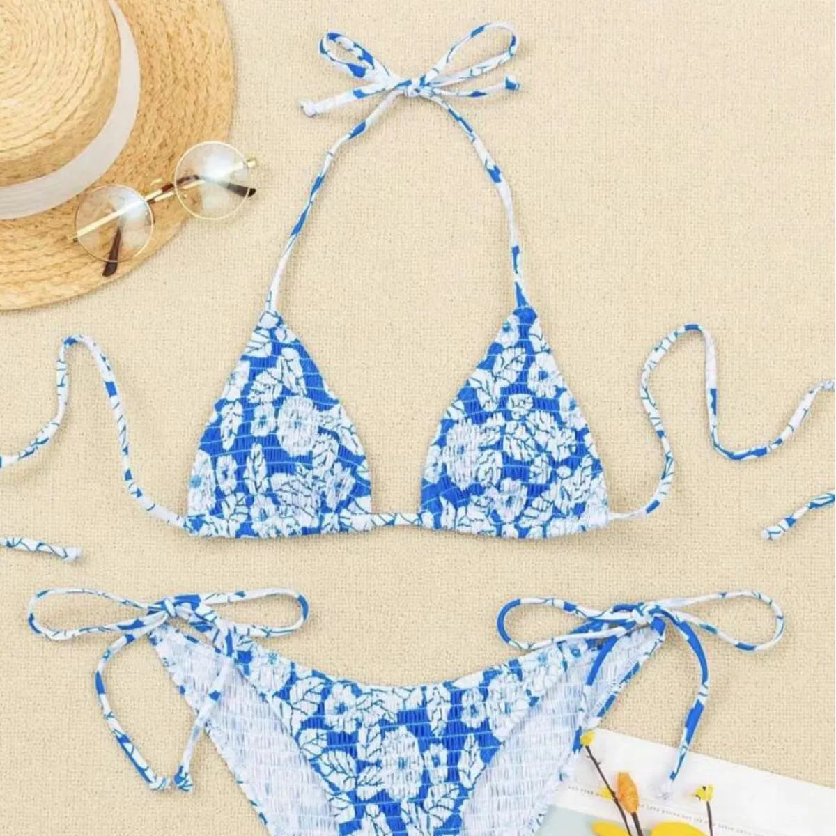 Women's floral halter neck swimsuit set in polyester fabric showing bra top and briefs