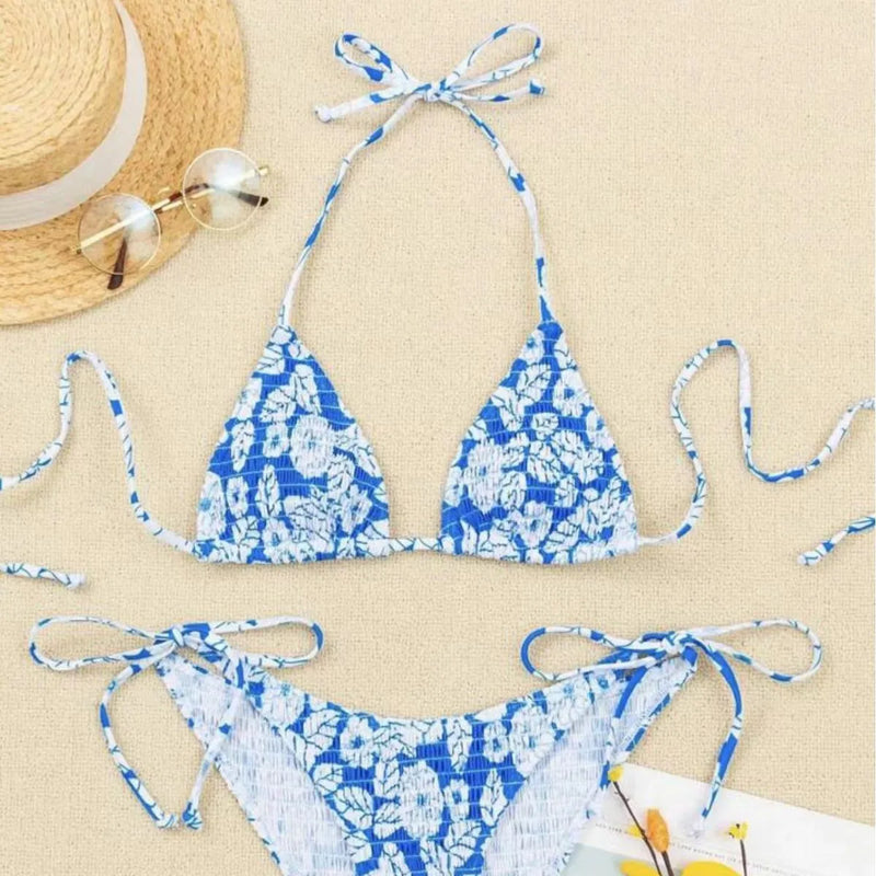 Women's floral halter neck swimsuit with briefs in polyester fabric available in pink, rose red, orange red, light blue and sapphire blue colours across Asian sizes S, M, L, XL and XS with sizing advice for European and American shoppers