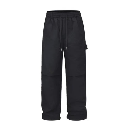 Black tooling paratrooper pants with elastic waist drawstring closure and baggy three-dimensional cutting