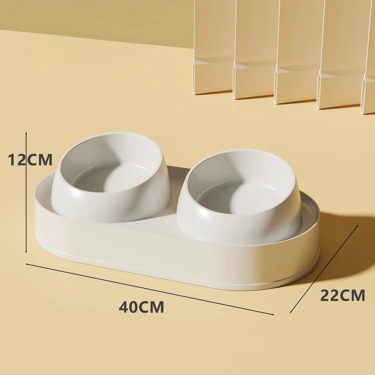 White elevated pet double bowl feeder with tilted food and water bowls on a non-slip stand.