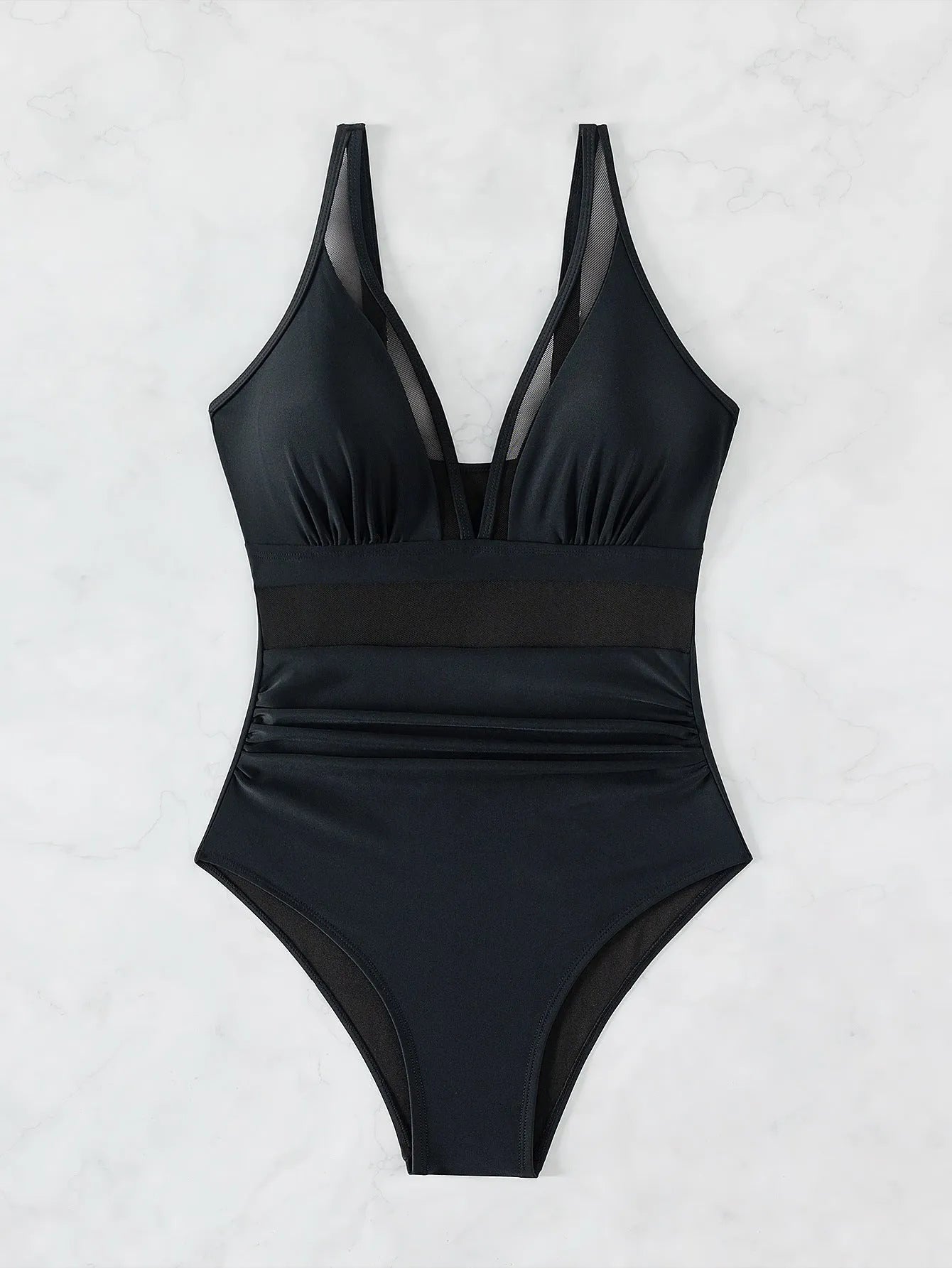 Black halter neck one-piece swimsuit with mesh panels, shown on a model.