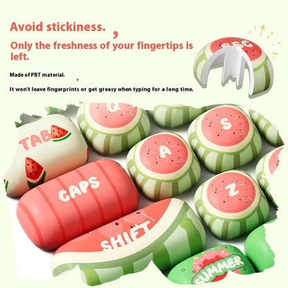 Set of 138 watermelon-themed PBT key caps with green, red, and black dye-sublimated design, shown on a mechanical keyboard.