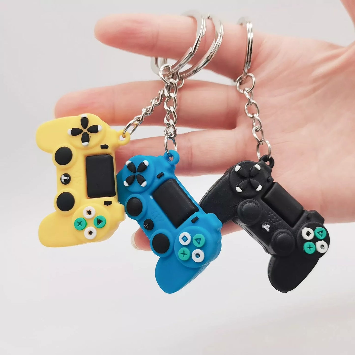 Simulation Toy Game Machine Car Keychain in blue, grey, yellow, and green