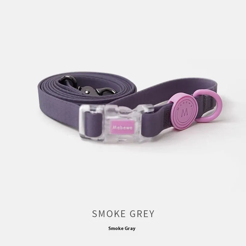 Nylon dog collar and hand holding rope in smoky gray, new green, lemon yellow, and rose pink colour options.