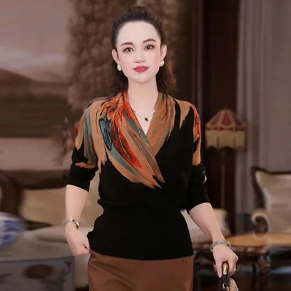 Black geometric floral pattern V-neck sweater with long sleeves and loose fit on hanger