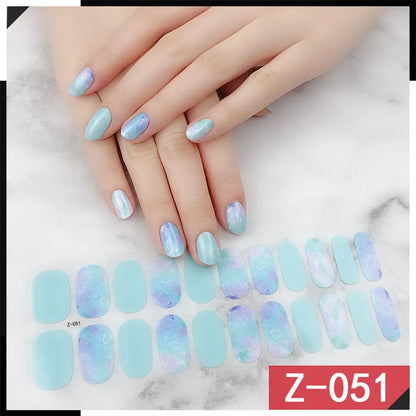 Korean nail stickers sheet showing cartoon, flower, and strawberry patterns with a nail file.