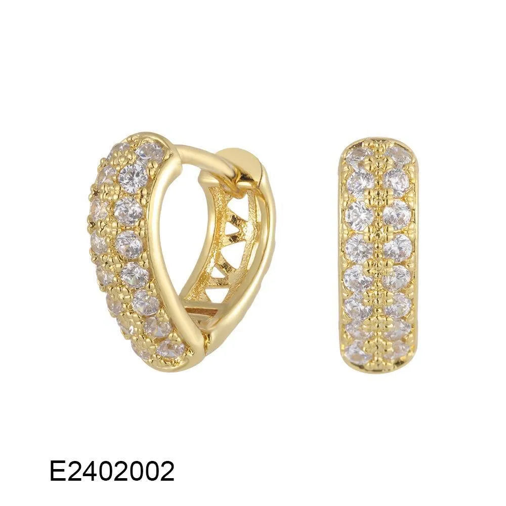 Gold plated heart-shaped clip earrings with a small zircon stone cluster on a copper base.