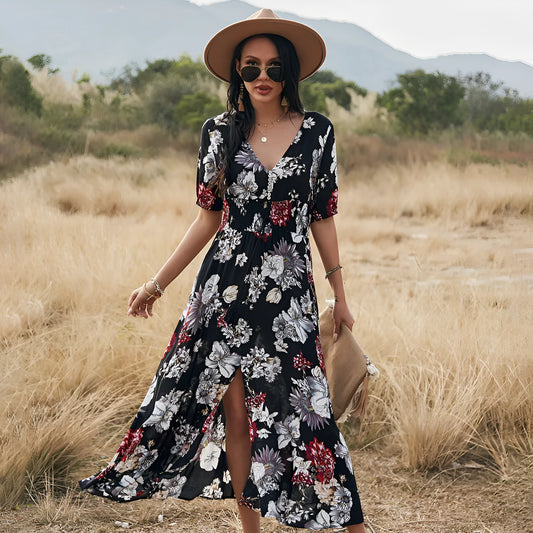 Yellow floral print women's dress with V-neck, short sleeves, elastic waist, and a large hemline midi skirt.