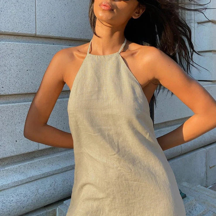 Women's solid colour linen A-line summer dress on hanger showing relaxed silhouette