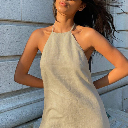 Women's solid colour linen A-line summer dress on hanger showing relaxed silhouette