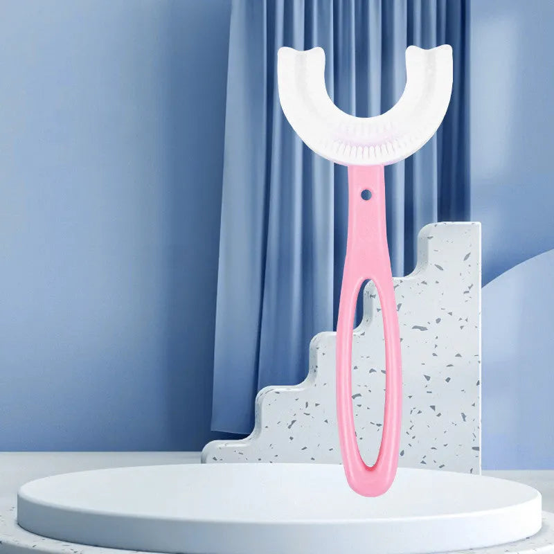 Children's U-shaped soft rubber toothbrush in pink and blue colours.