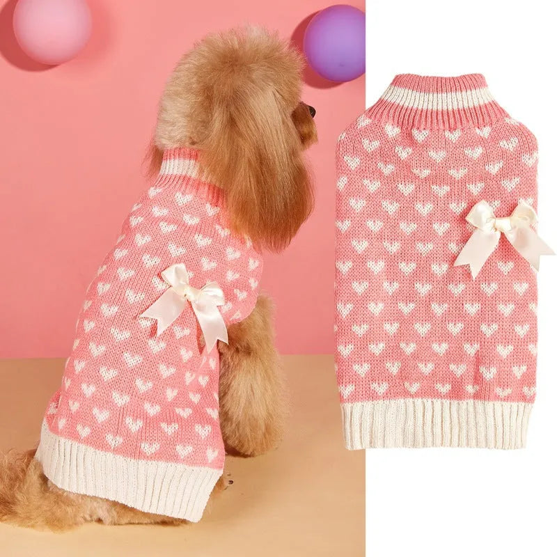 Red love heart pattern dog sweater with pink bow decoration on small dog