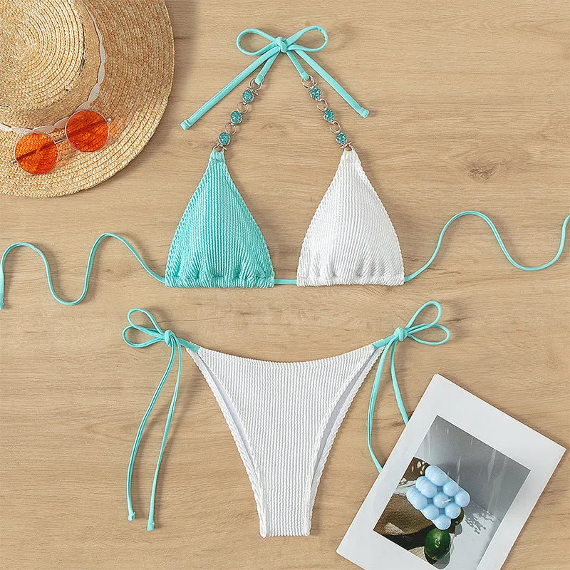 Colour-matched women's lace-up bikini with pearl chain detail on a sleeveless top and shorts.