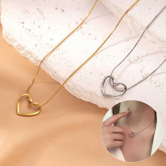 Stylish titanium steel heart pendant necklace with unique twist design, available in gold and silver colors
