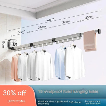 Aluminum retractable drying rack mounted on a window, extending outward for clothes drying