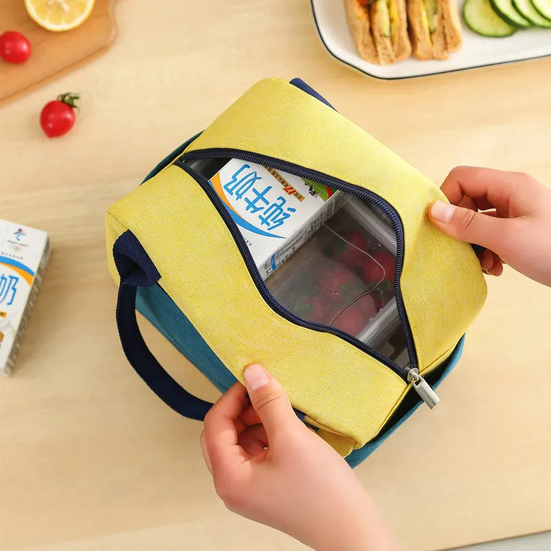 Aluminium foil thickening lunch insulation bag for travel with waterproof Oxford cloth construction available in four modern colour options including blue, yellow green, pink, and green beige for multi-purpose food transport use