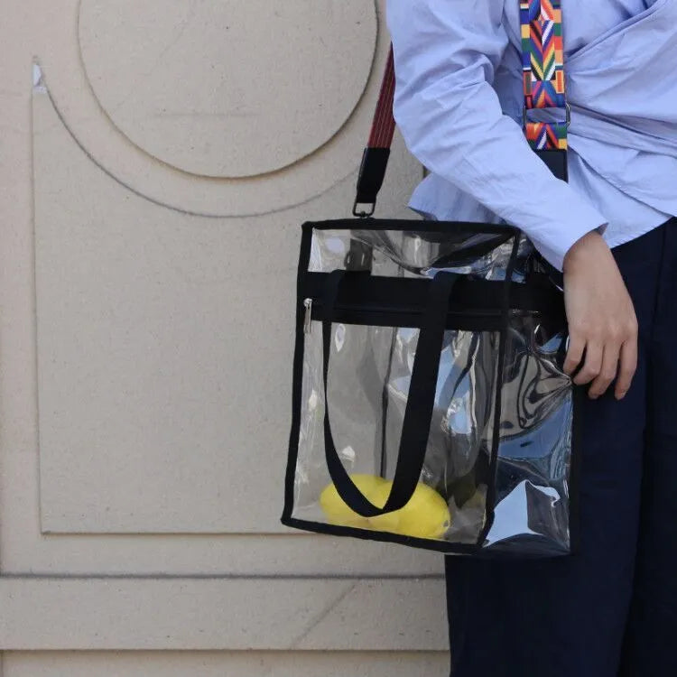 Women's PVC transparent shoulder messenger bag showing clear front panel with colour options and dual strap design