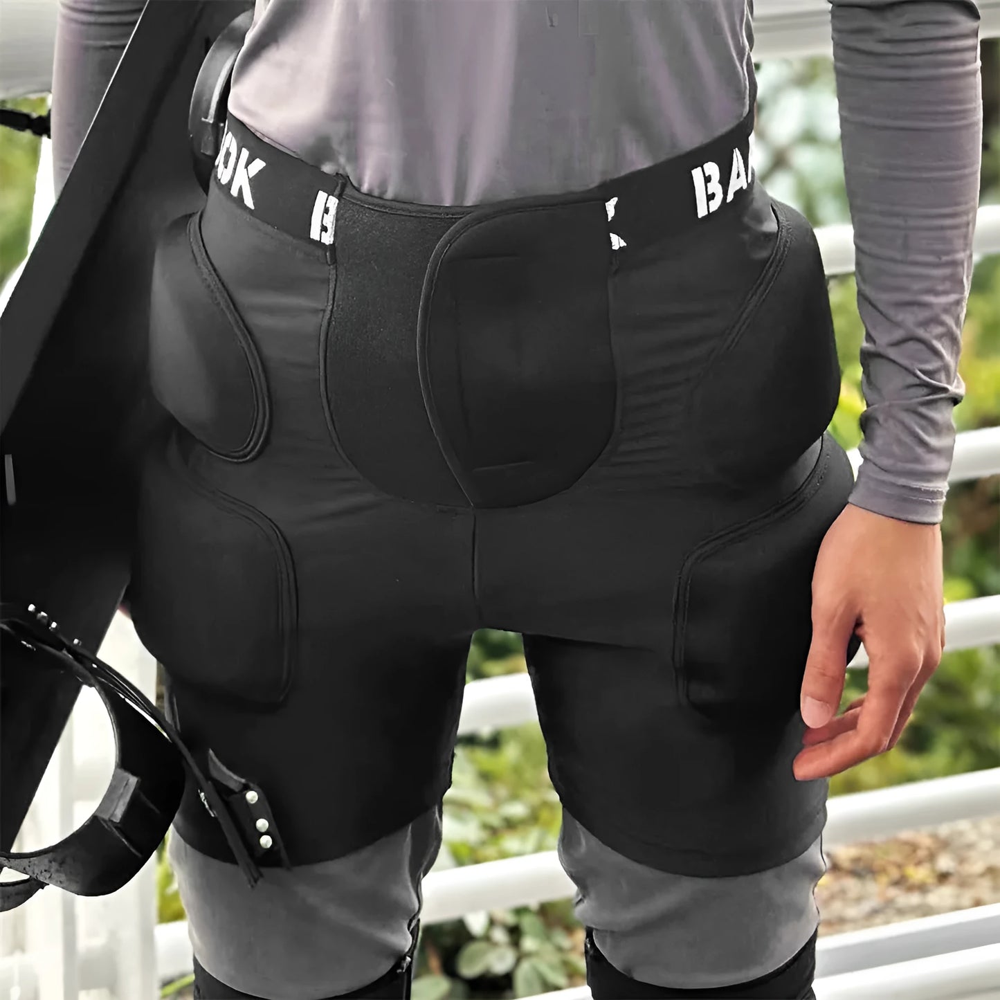 Black roller skating hip pad pants with NBR foam protection panels for skateboarding