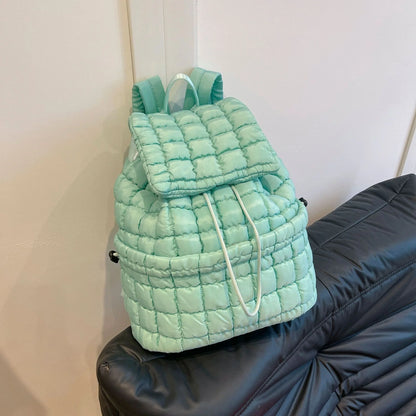 Soft, quilted puffer backpack in a variety of colors, perfect for autumn and winter wear