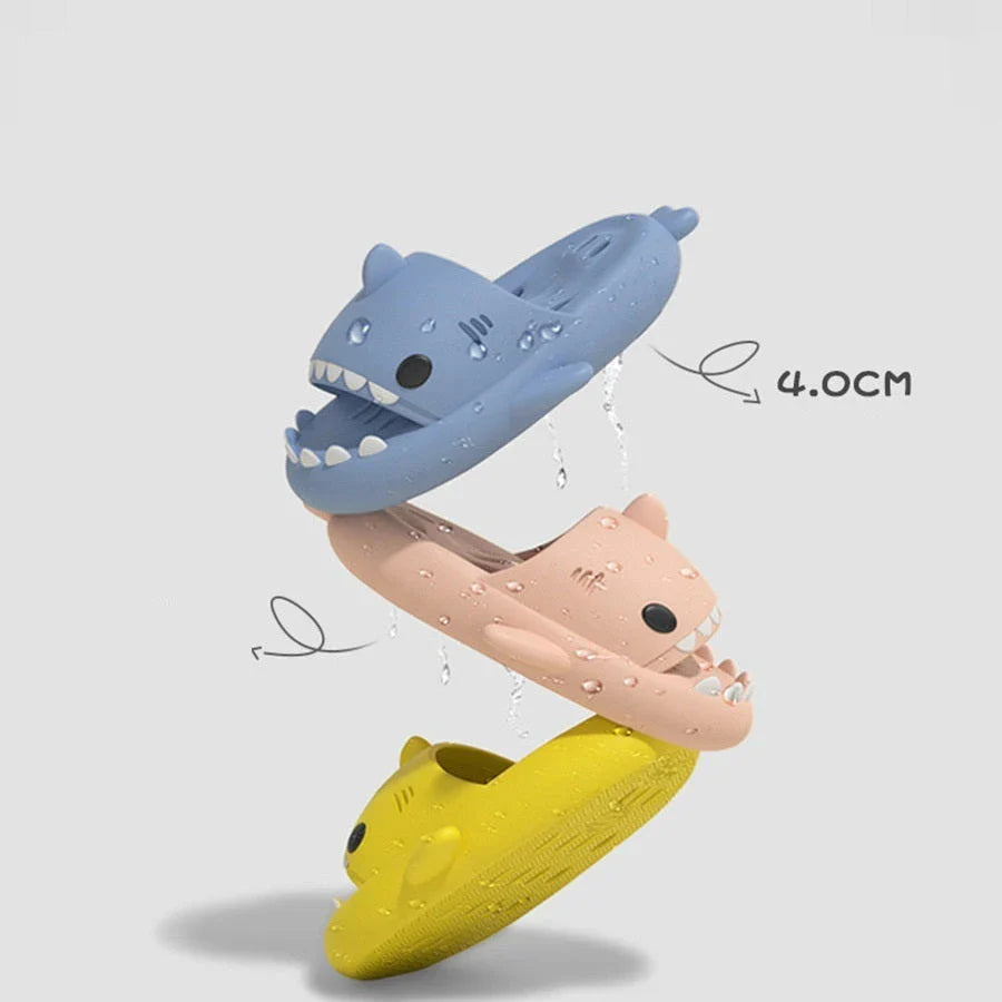 Colorful shark-themed shower slides with drainage holes, designed for comfortable and practical use in the pool or shower.