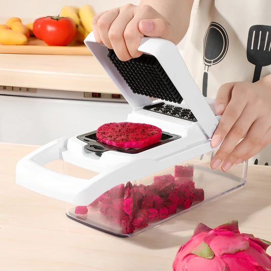 Multipurpose vegetable cutter with seven blades, drain basket and accessories on kitchen counter