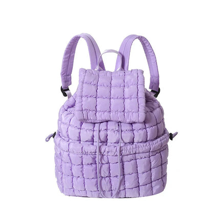 Soft, quilted puffer backpack in a variety of colors, perfect for autumn and winter wear